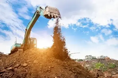 An excavator action in a land clearing project